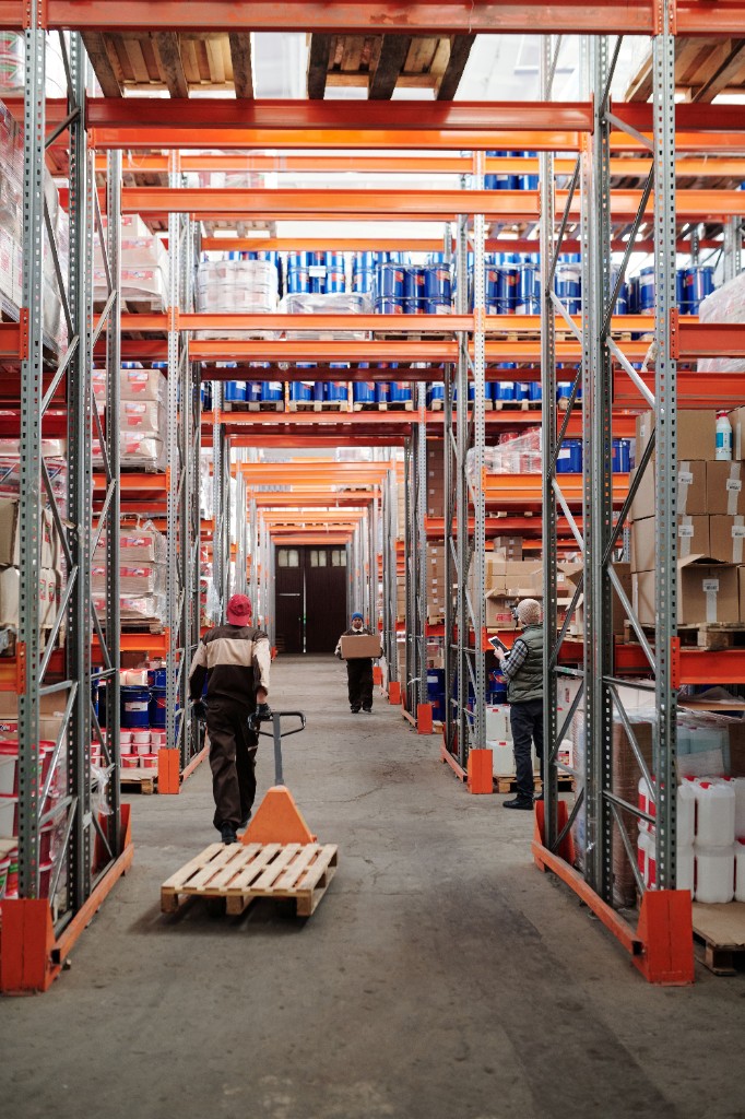 Workers in a warehouse aisle
